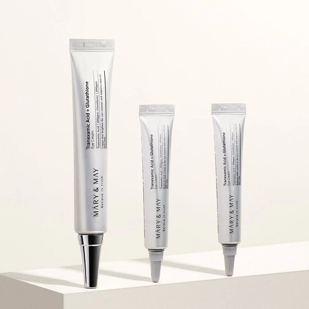 Three skincare tubes from Mary & May on a light beige background