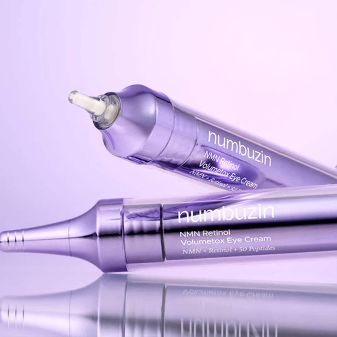 Two purple eye cream tubes with 'numbuzin' branding on a light purple background