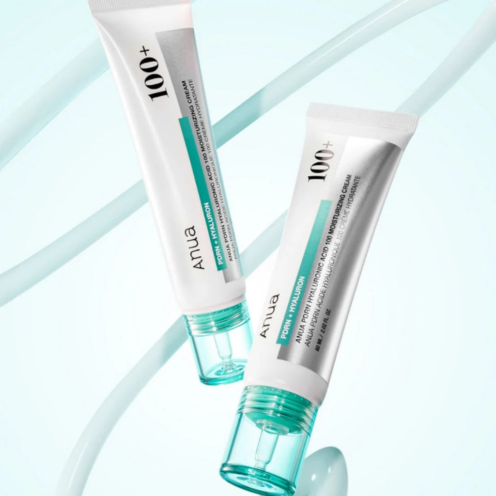 Two tubes of ANUA 100+ cream on a light blue background