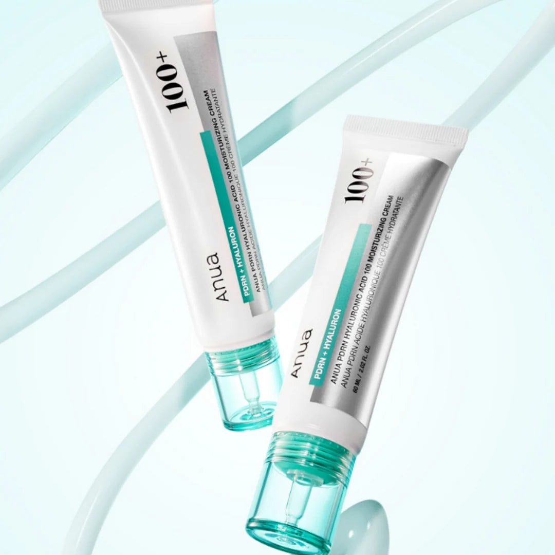 Two tubes of ANUA 100+ cream on a light blue background
