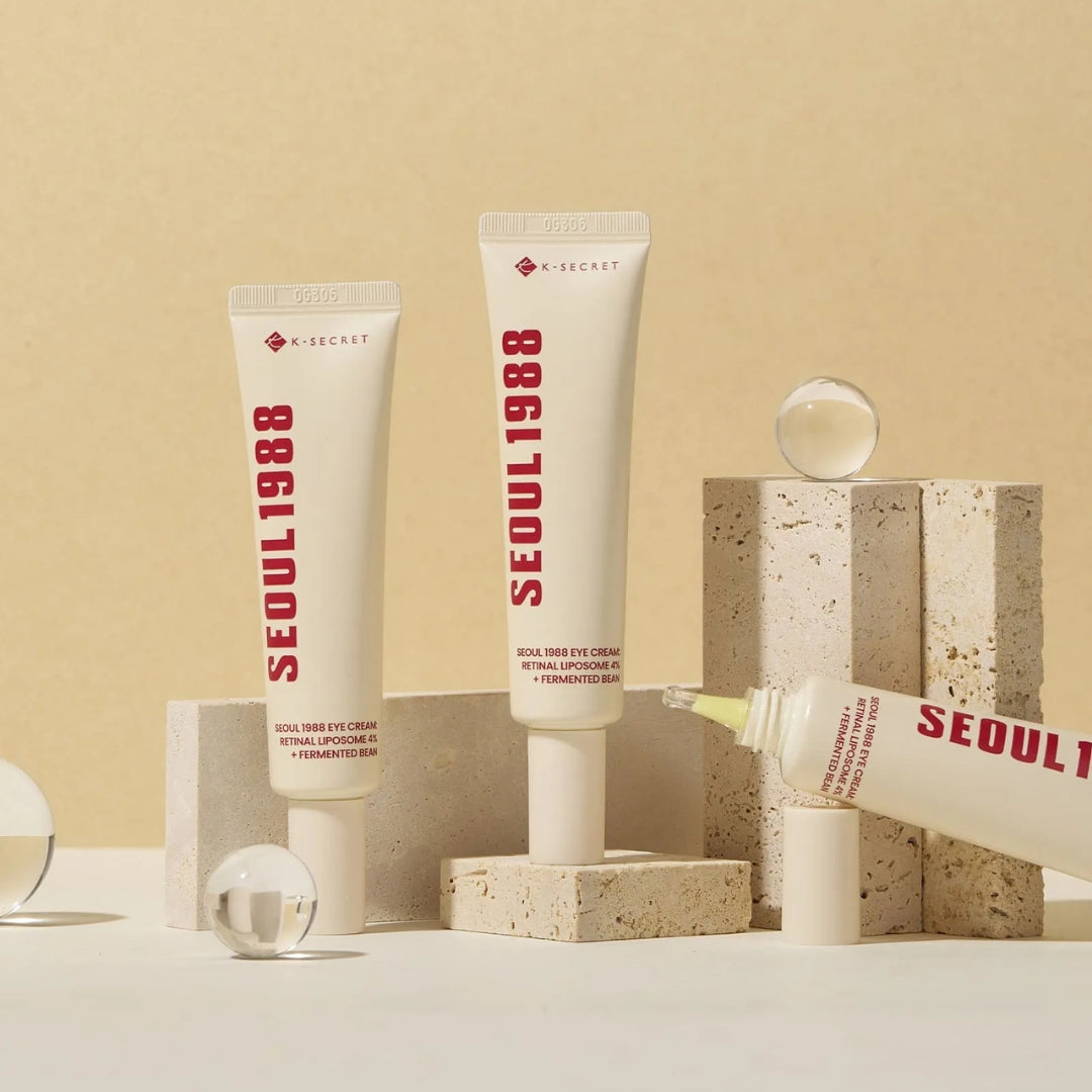 Skincare tubes labeled 'SEOUL 1988' on a beige background