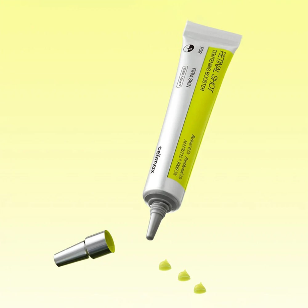 Yellow and white cosmetic tube with applicator on a light yellow background