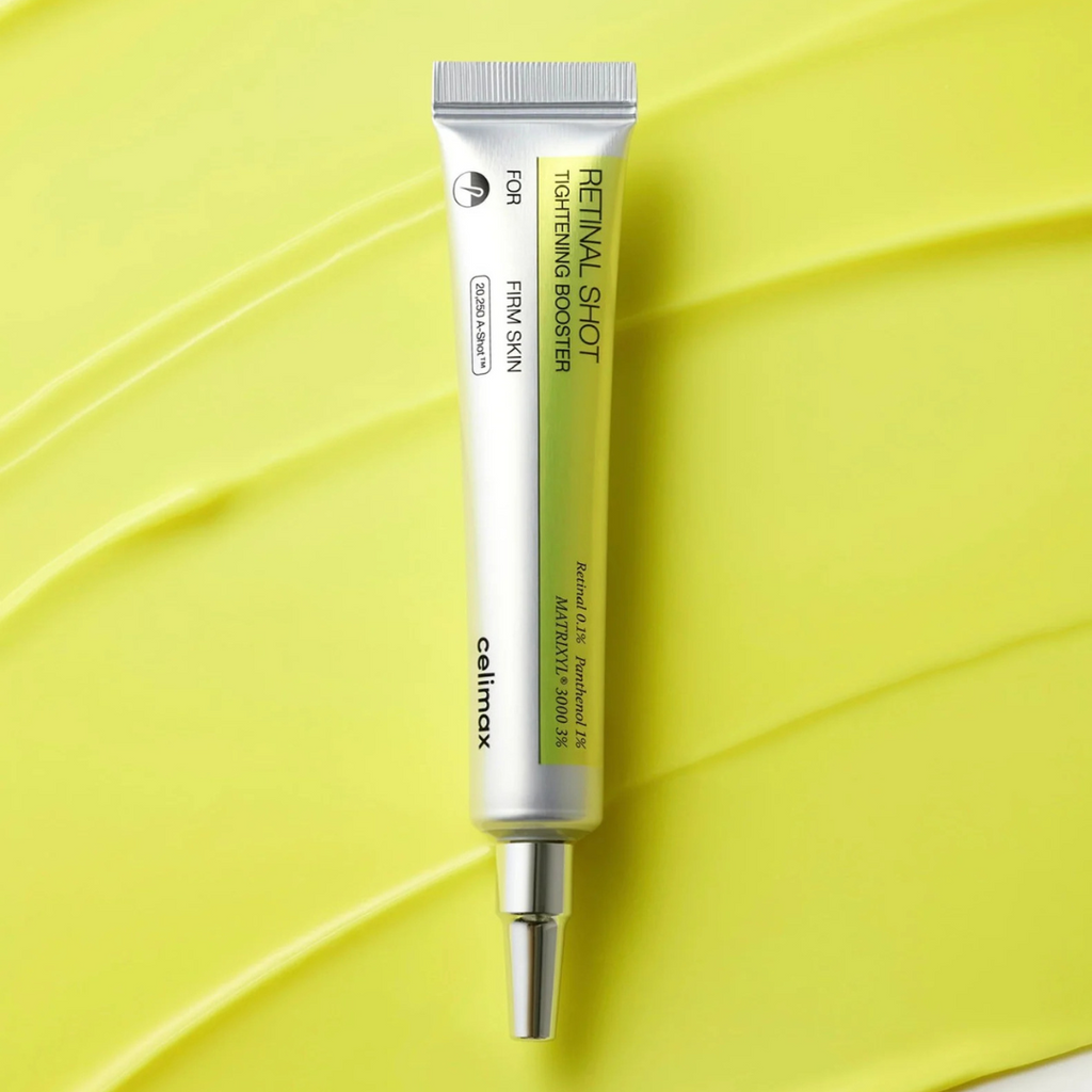 Skincare serum tube on a yellow leaf background