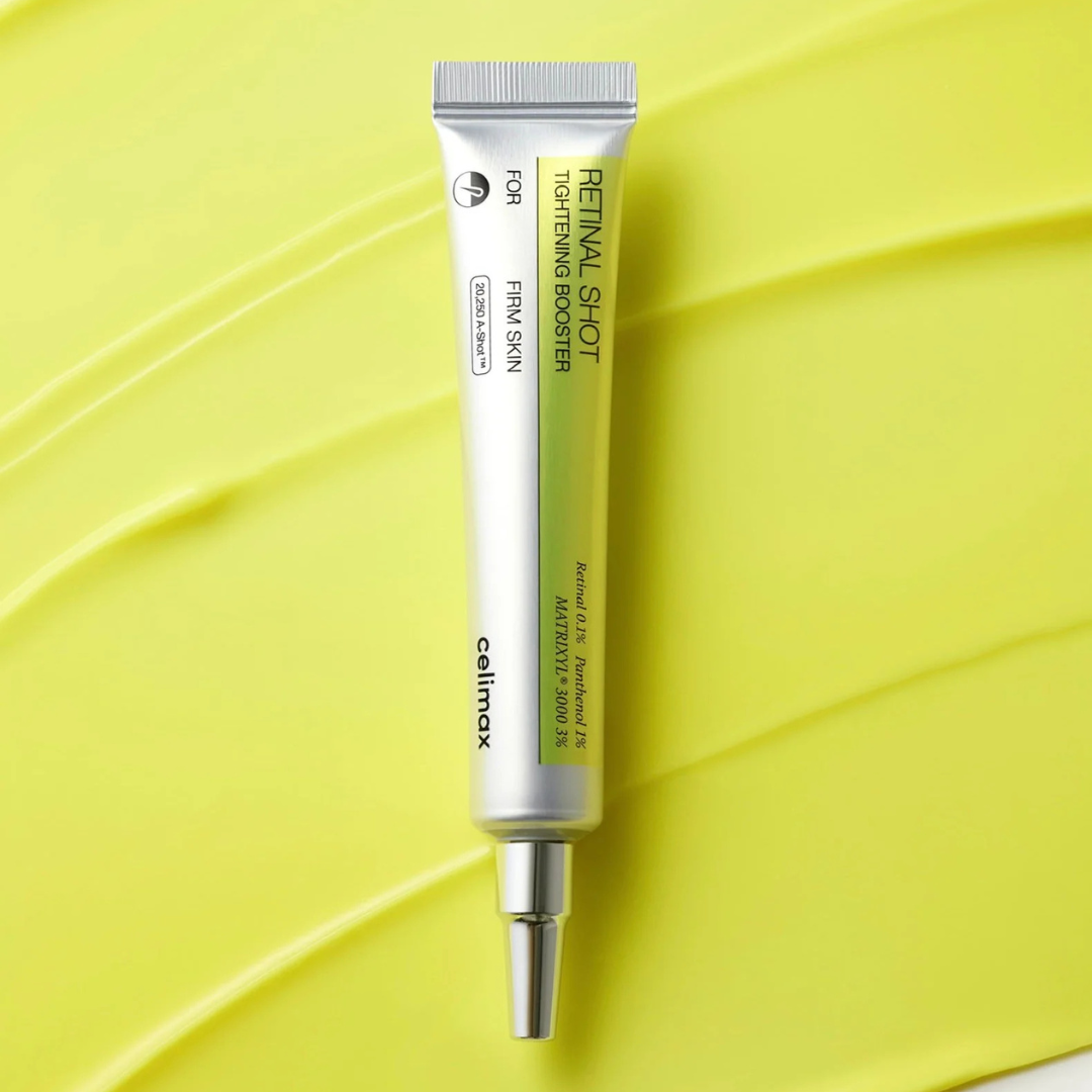 Skincare serum tube on a yellow leaf background
