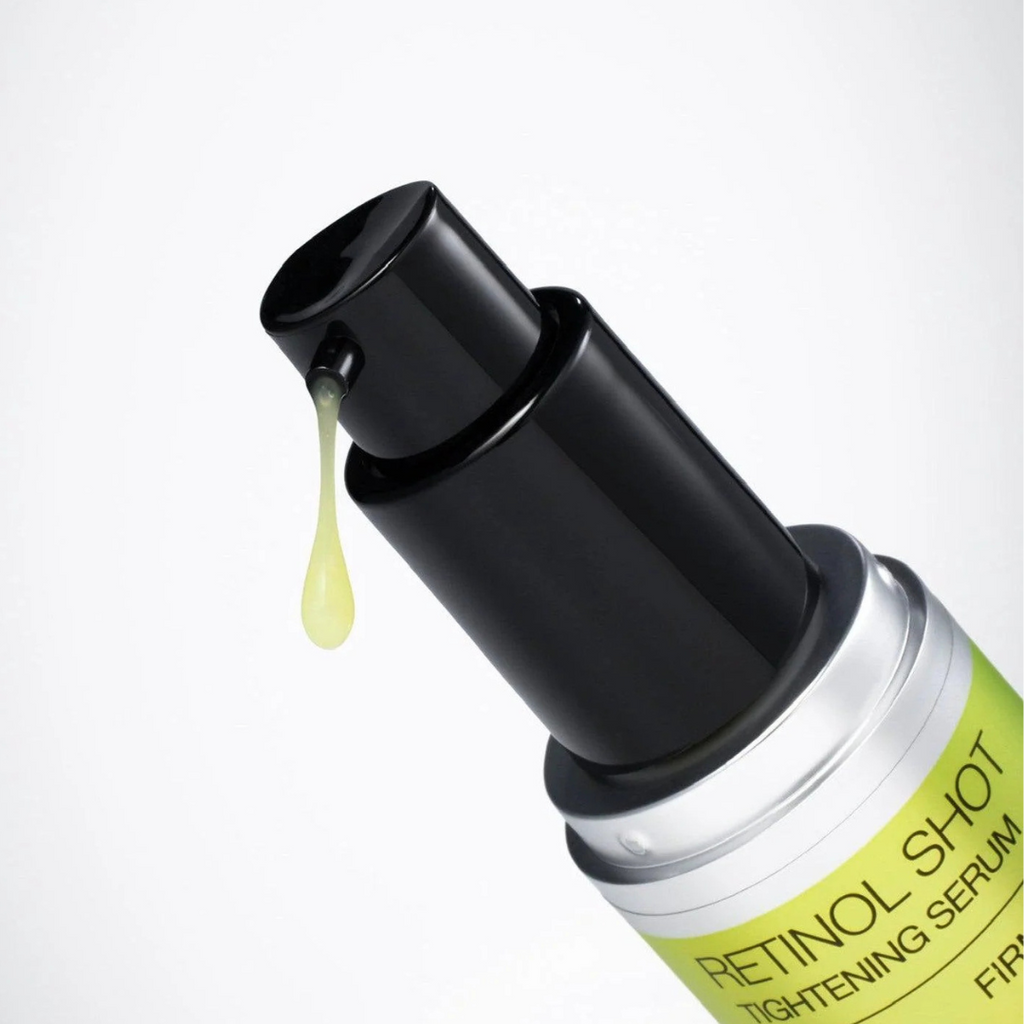 Retinol shot tightening serum with dropper on a white background