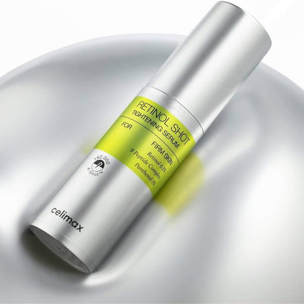 Celimax Retinol Shot Tightening Serum bottle on a reflective surface